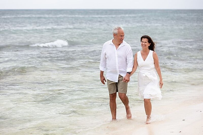 Photographer Mariela Duval, with husband Ty, walking on the beach