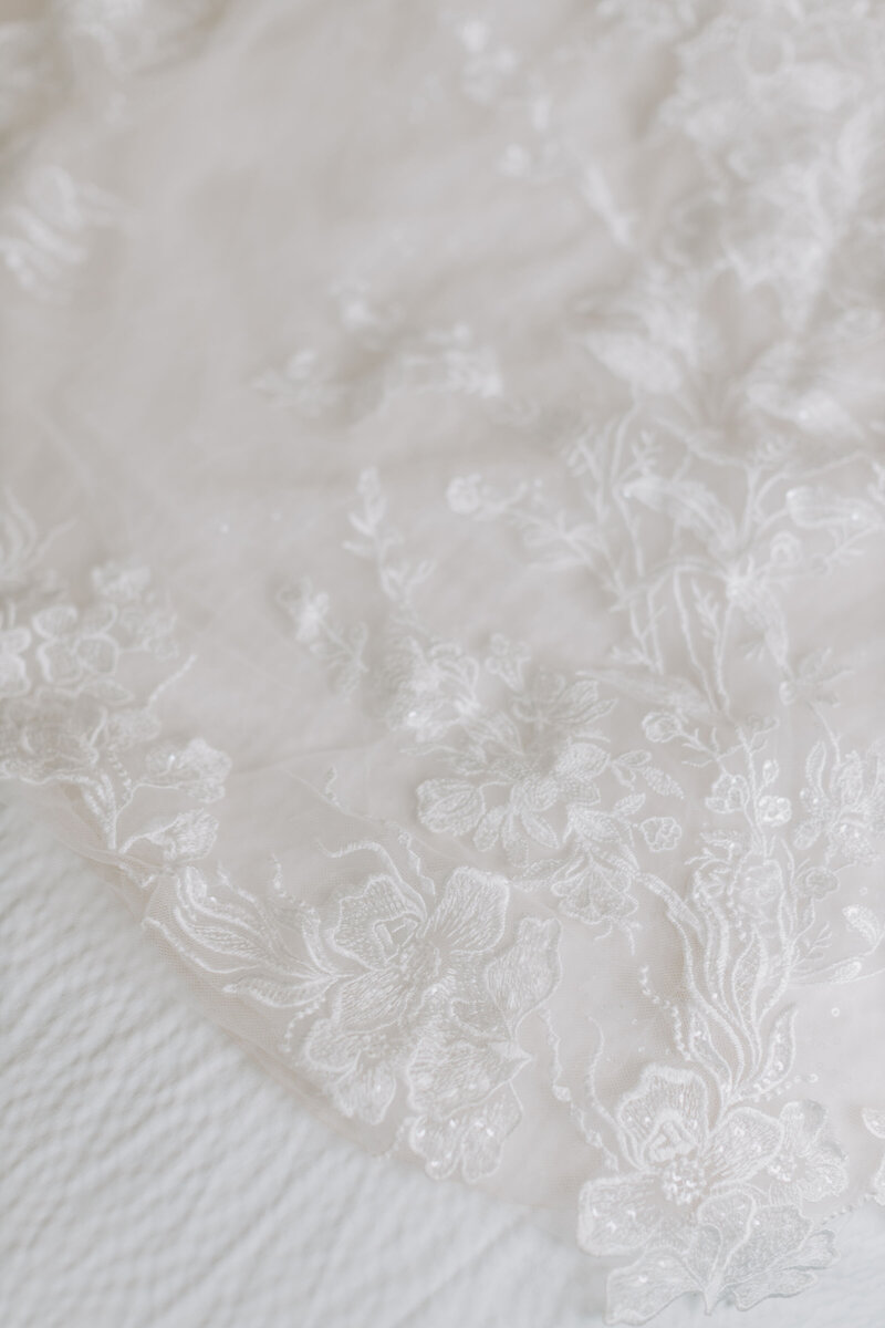 new jersey wedding photo by Blooming Faith Photography detail shot of white floral lace wedding dress