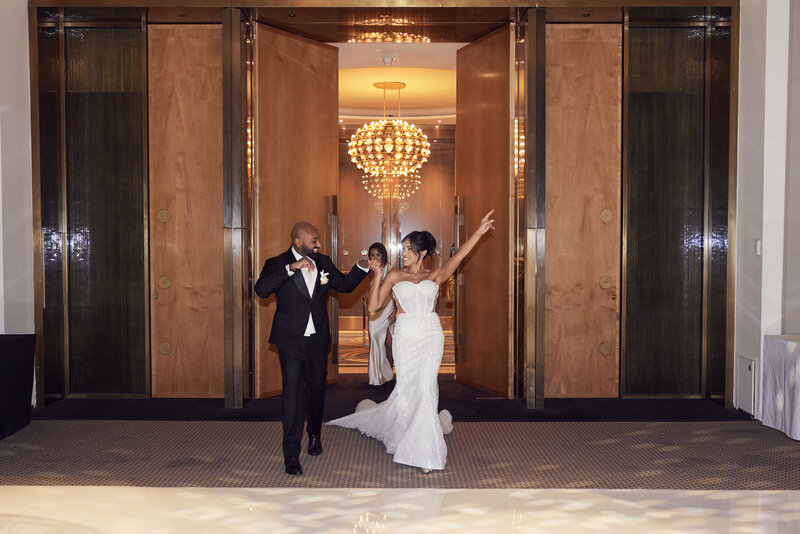 Couples holding hands during their wedding entrance, embodying the fine balance between fun and finesse offered by LIMCO.