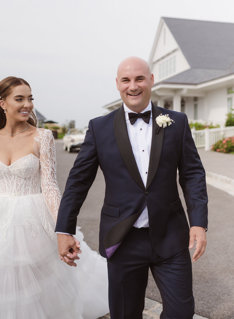 candid walking shot of the groom and bride on wedding day