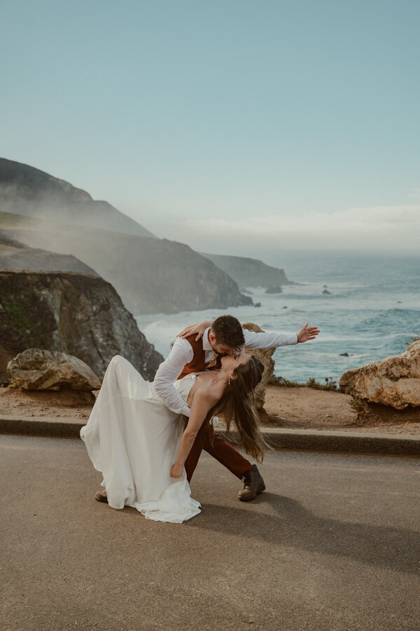 bride and groom in Big Sur dancing by bixby bridge