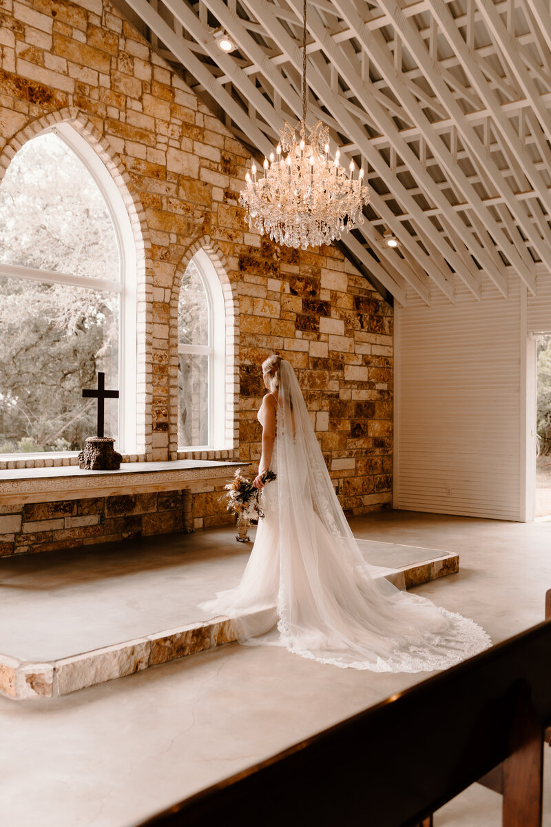 bride posing by windows