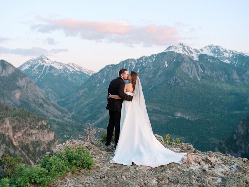Sunset mountaintop portrait of Colorado bride and groom