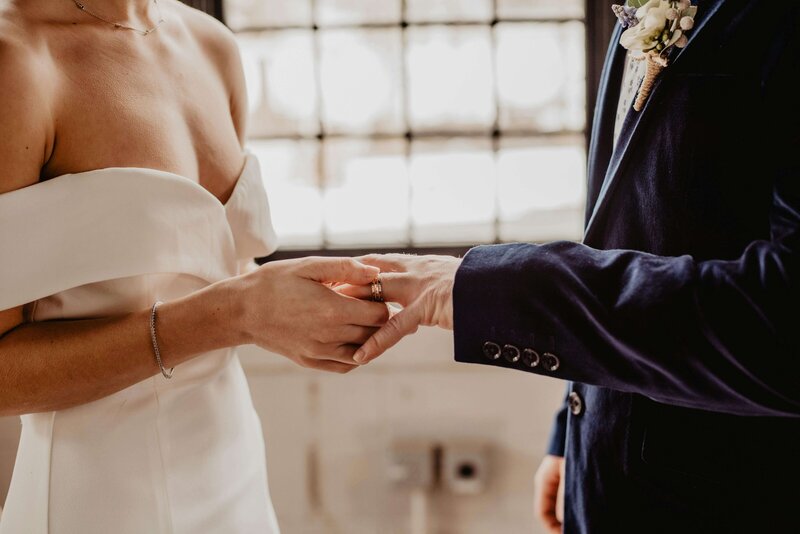 Bride and groom holding hands