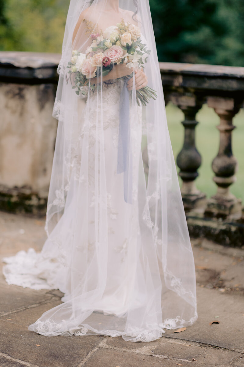 bride holding wedding flowers