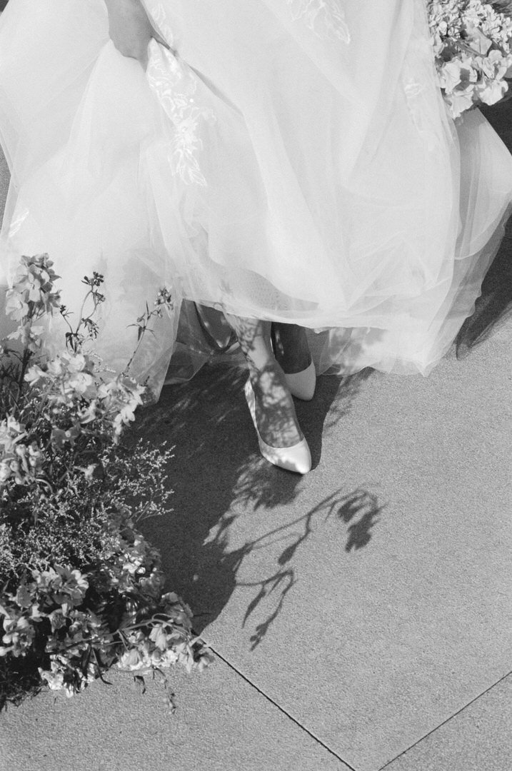 bridal shoe walking through floral shadow
