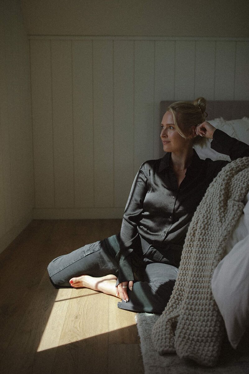 Lauren, founder of Studio Only You, seated in soft light with a calm and thoughtful expression