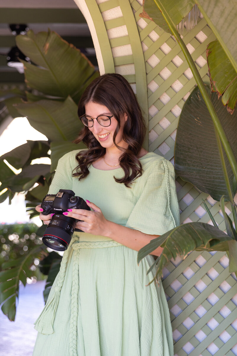 Portrait of photographer smiling at her camera
