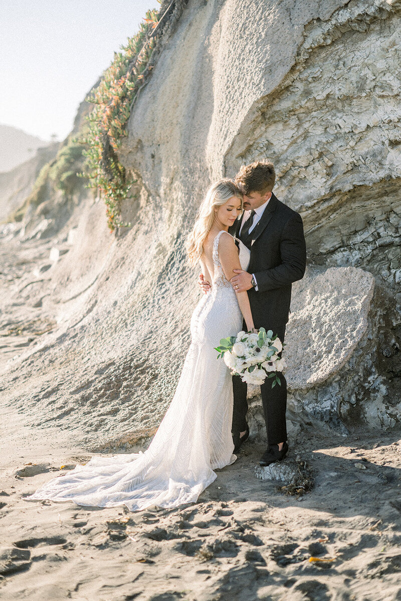 Intimate Cliffscape Embrace: Exclusive Big Sur Wedding Photography by Renowned California Hybrid Photographer