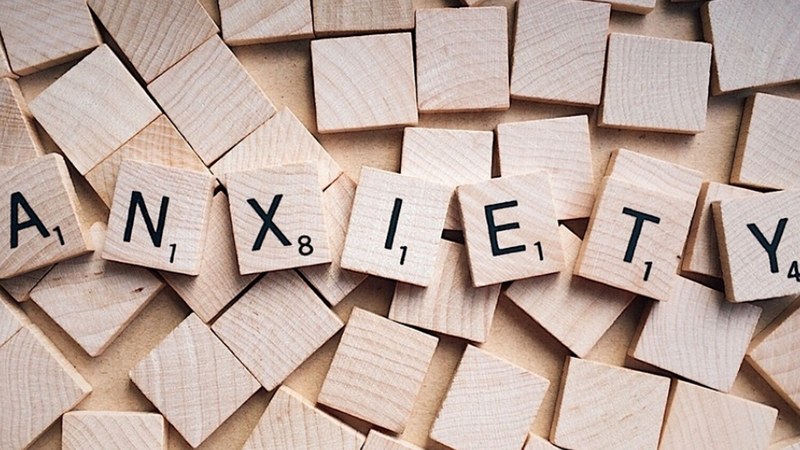 Wooden letters spell out the word anxiety