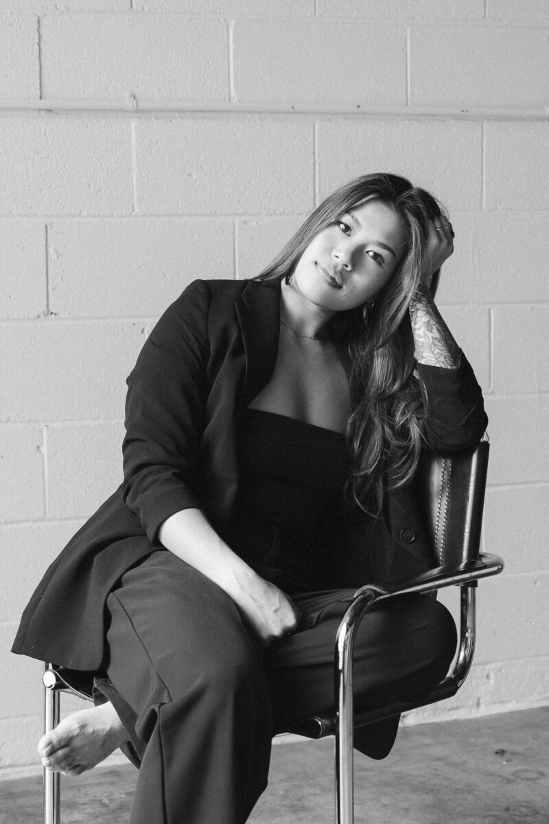 susan ly sitting on chair