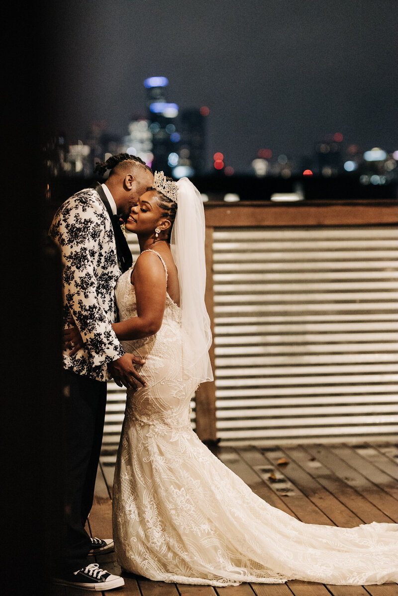 black wedding couple takes night time portraits on  downtown seattle rooftop