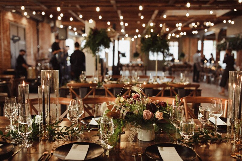 elegant wedding reception with florals, candles and fairy lights