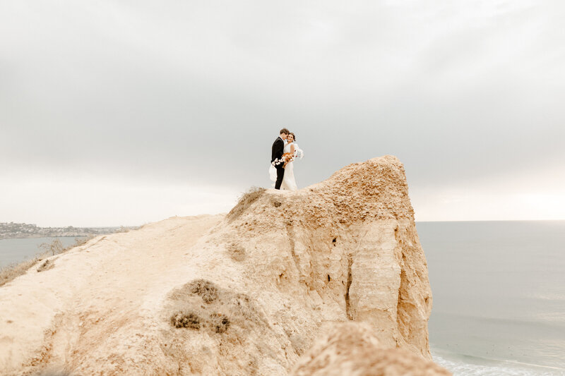 bride and groom at cliffside wedding in Southern California