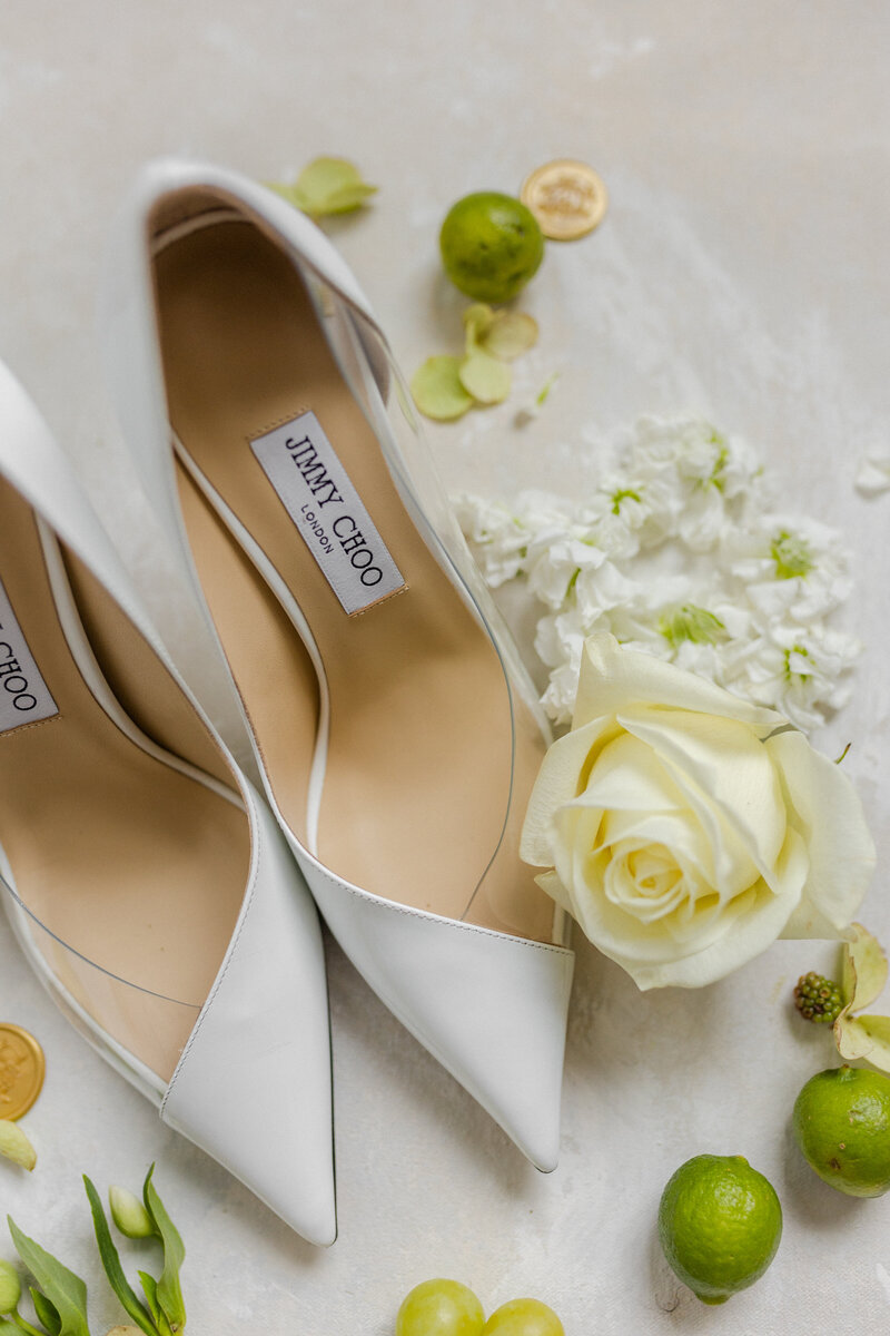 jimmy choo shoes with limes and white roses during a downtown dallas texas wedding