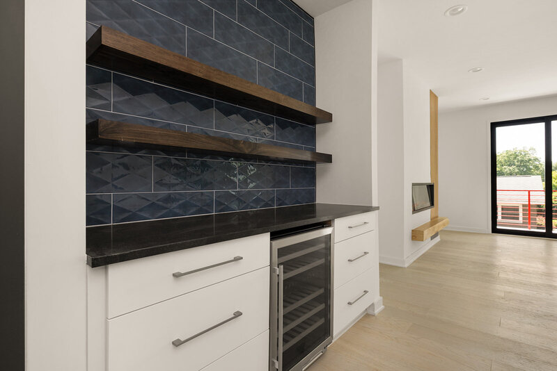 kitchen bar with navy blue tile backsplash