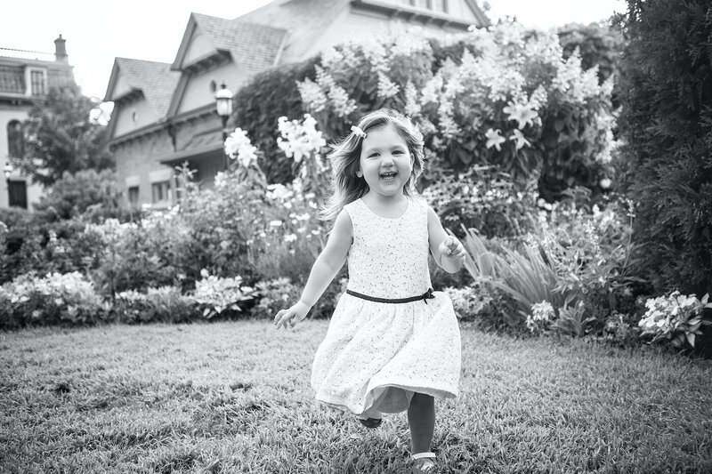 black and white photo of young girl running