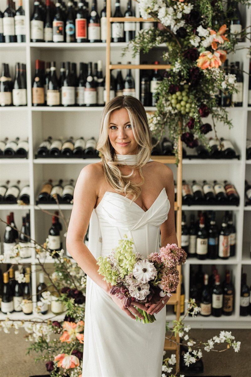 Petite spring bridal bouquet with ranunculus, hellebore, and fritillaria