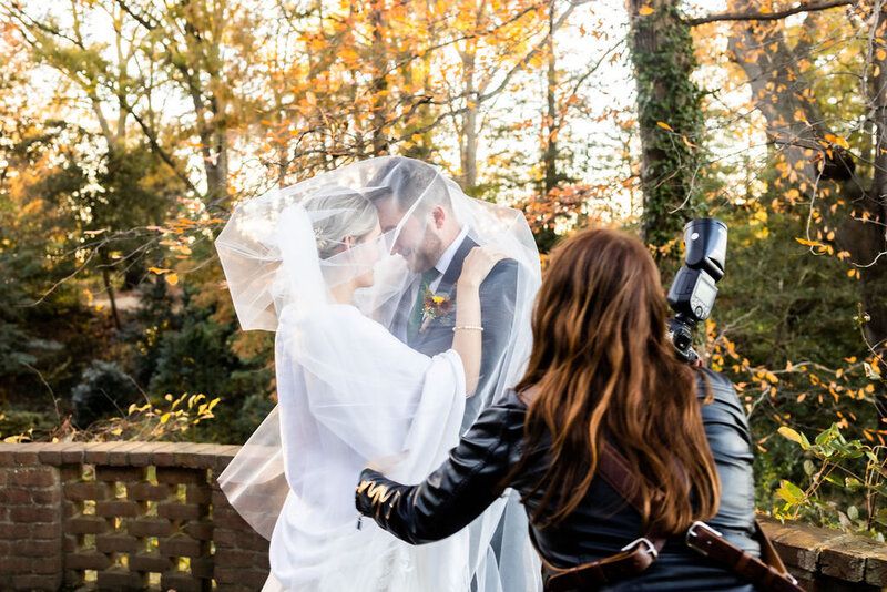 Baltimore Wedding Photographer Kimberly Dean arranges a veil for a bride before a photo