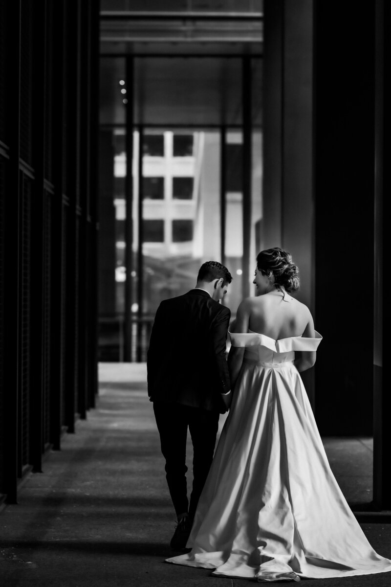 bride groom signing during first dance with blue up lighting at Liuna Station