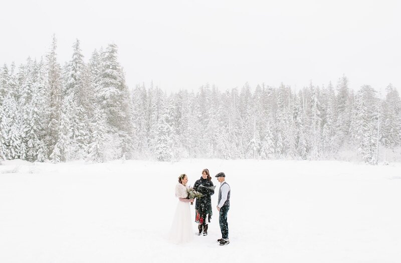 snowy mt hood elopement ceremony on a frozen lake