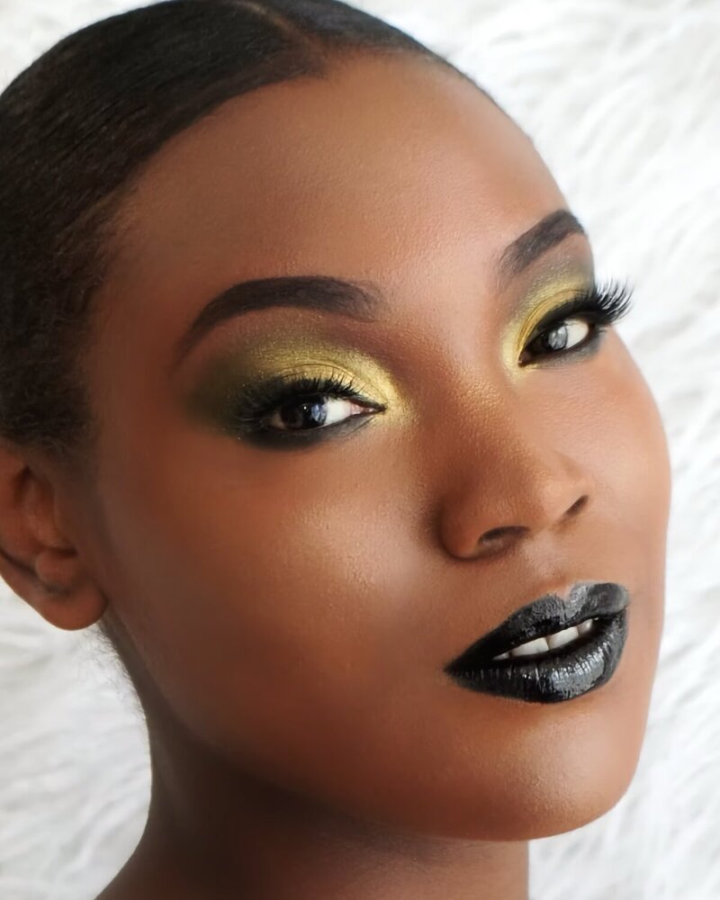 Full glam makeup with gold eyeshadow and black lip created by Jessica, a makeup artist in Bethel, CT.