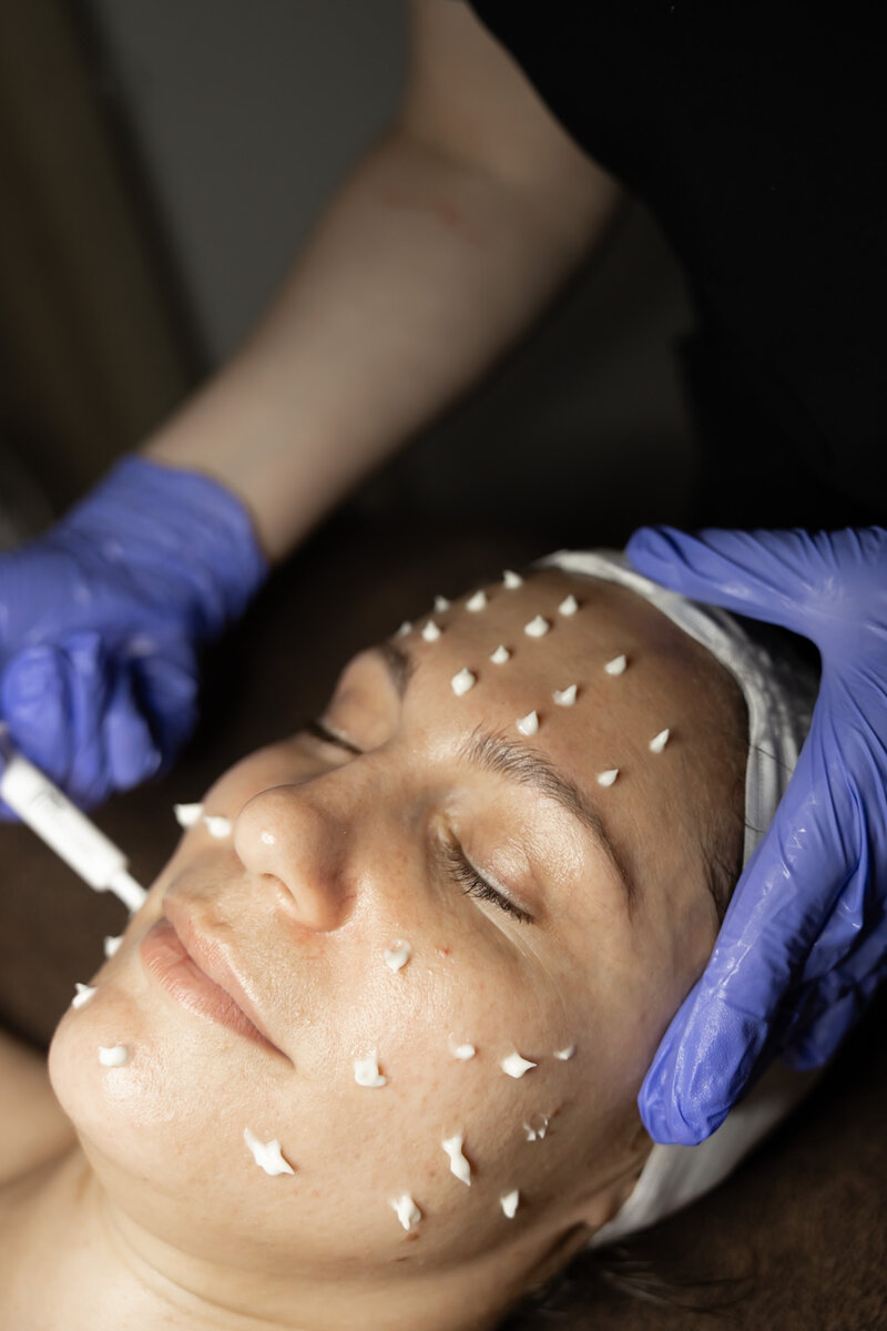 Karli giving client a facial massage