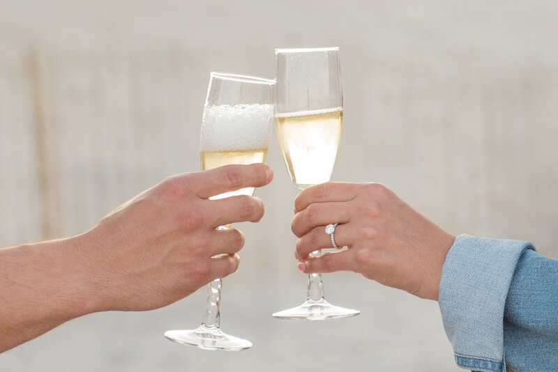 champagne toast at engagement session surprise proposal