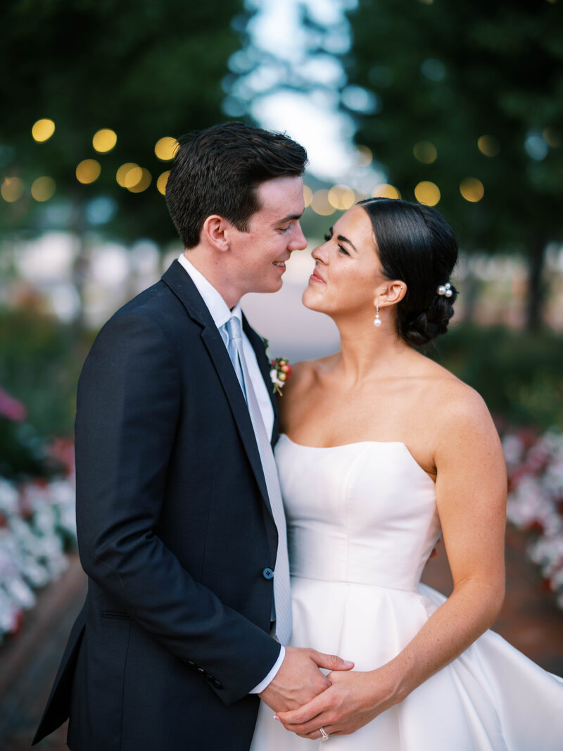 Bride and groom holding hands at Lafayette Park  outside by Colorado wedding Photographer JKG Photography