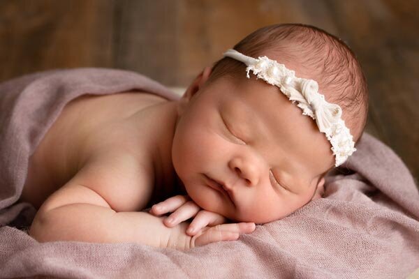 Fond du Lac Newborn Photo session baby in pink sleeping in studio | Glory Be Photography by Tara Bos