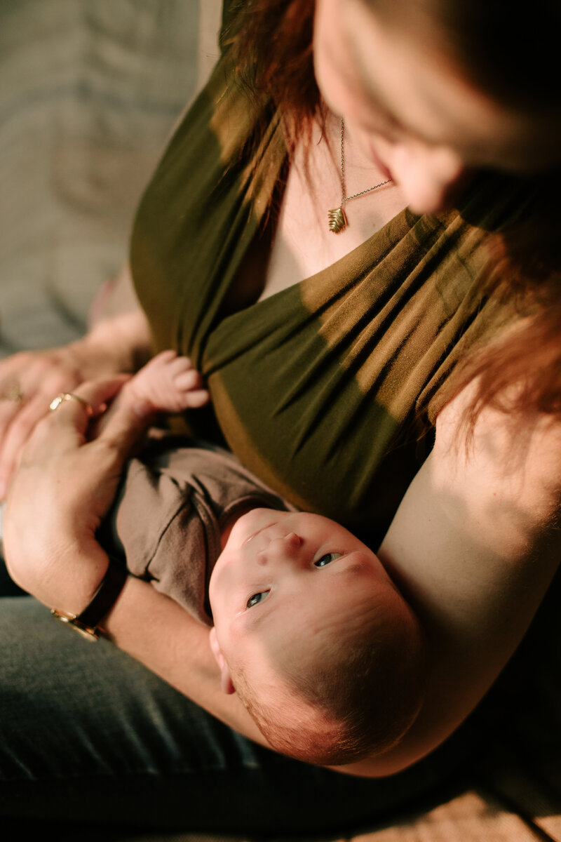 Relaxed newborn photos, mom holding son 