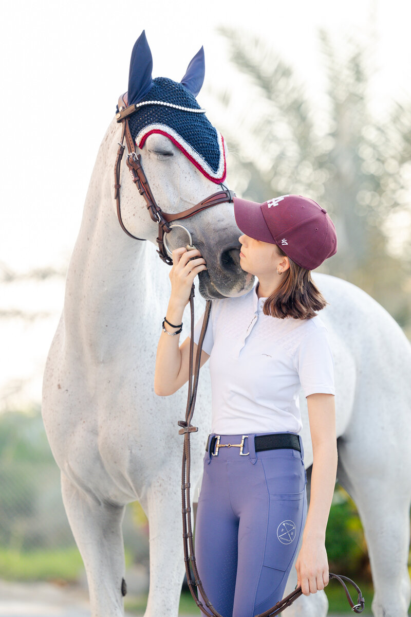 Girl riding brown horse