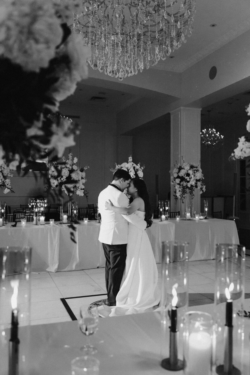 Couple sharing their first dance surrounded by guests — photographed by Houston wedding photographers Julie & Daniel