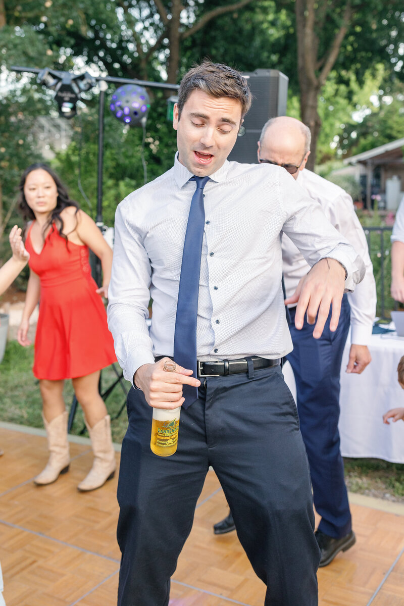 wedding guest dancing for an outdoor wedding reception documented by bay area photographers