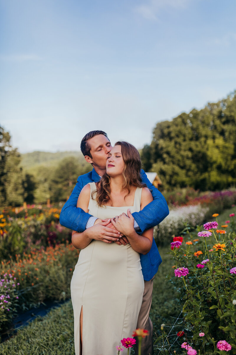 couple embracing in flower field