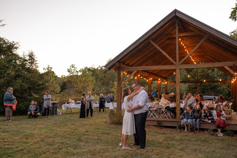 Bride and groom dance at outdoor reception