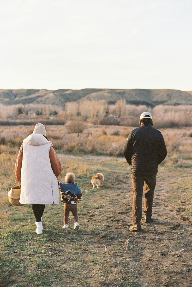 family walking out to a field together