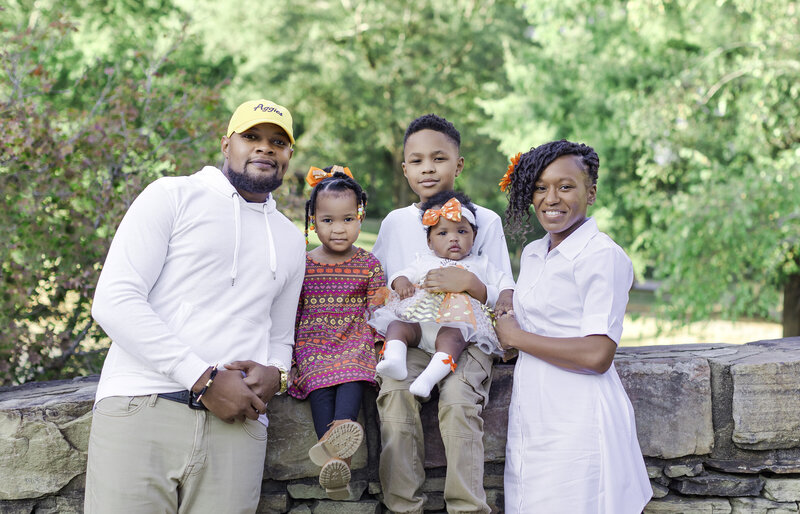 Charlotte, NC, family photographer who captured the precious moments at Freedom Park during the twilight hour. This family is beautifully framed by the natural scenery of one of Charlotte's most iconic parks. I-CanDee Photography specializes in creating heartfelt, timeless images that celebrate family bonds. Located in Charlotte, NC, and recognized in various publications, our photography highlights the love and connection within your family in stunning outdoor settings.