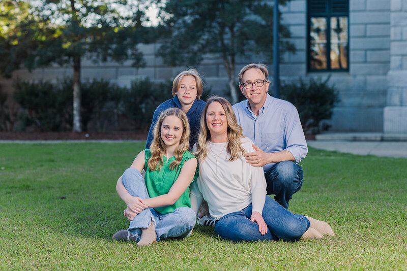 A family posing for family portraits in a park in downtown, Columbia, South Carolina