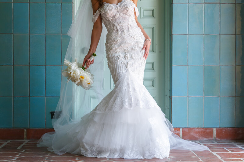 Bride with gorgeous Vera Wang gown dress holding bouquet flower arrangement at Greystone Mansion in Hollywood California.
