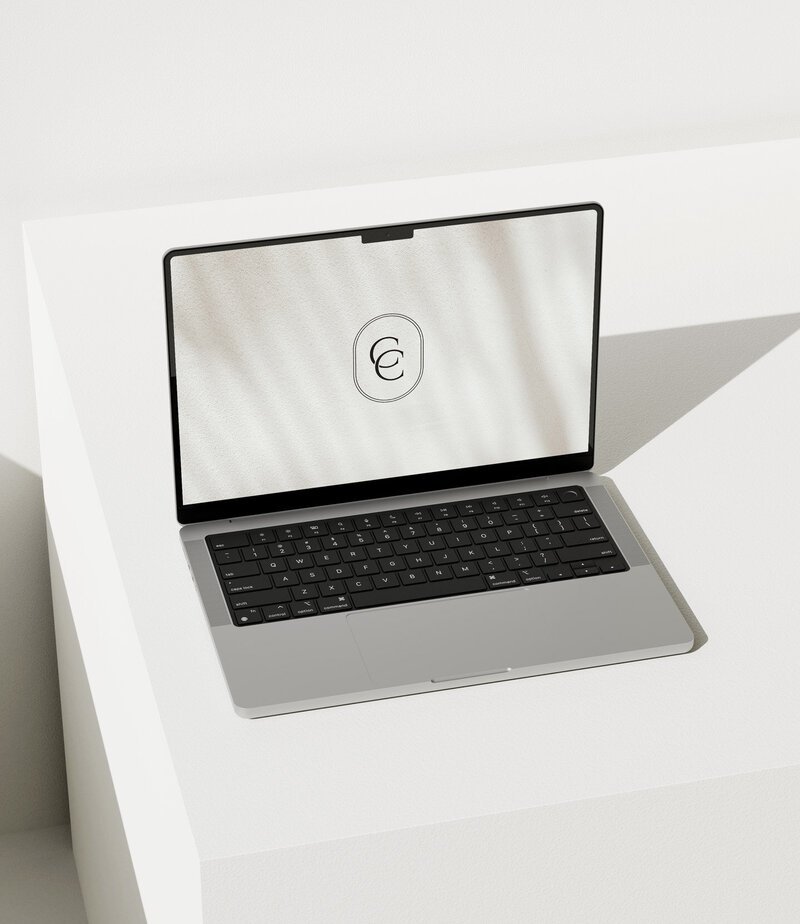 Open laptop with submark monogram logo 'CC'  on screen