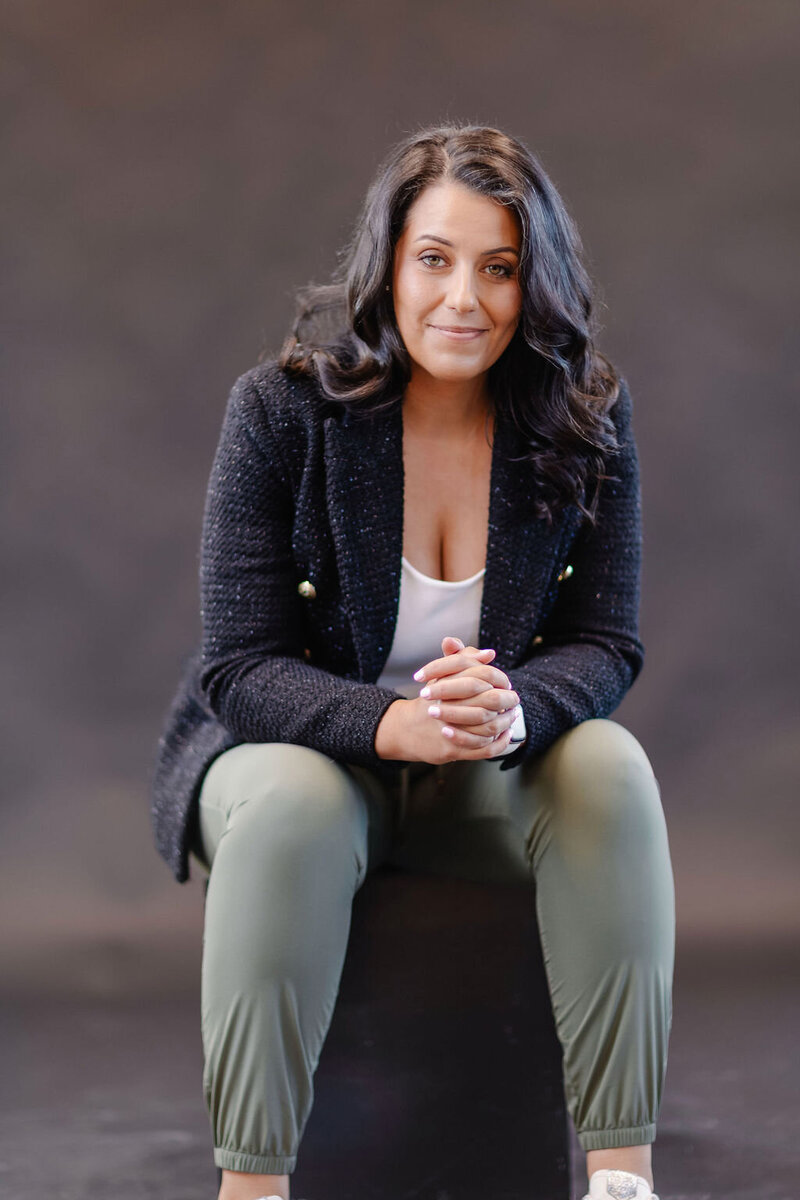 portrait of a woman with dark hair in a black blazer