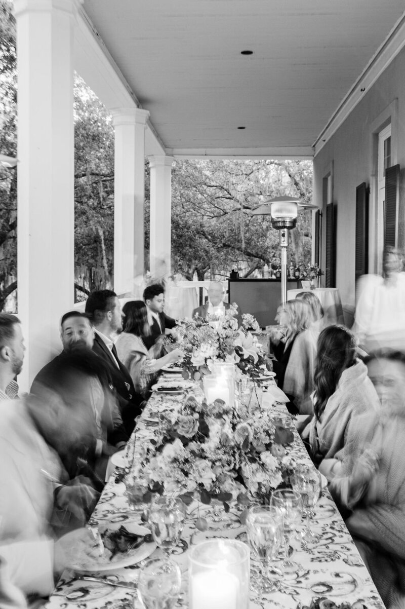 blurred image of dinner party on porch