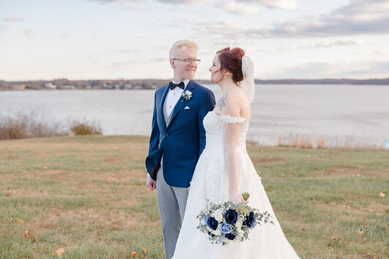 A bride and groom portrait at sunset at Bohemia Overlook. Photographed by Christopher Ginn Studios.