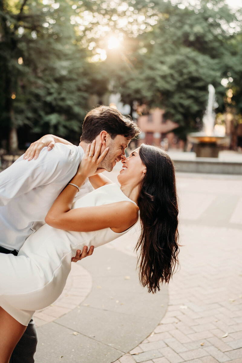 A sweet, loving moment between a couple in the north end of boston. A beautiful neighborhood with scenic views. 
