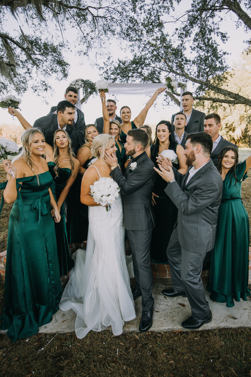 Bride and groom surrounded by their bridal party after their wedding ceremony at Woodberry in Havana, Florida near Tallahassee.