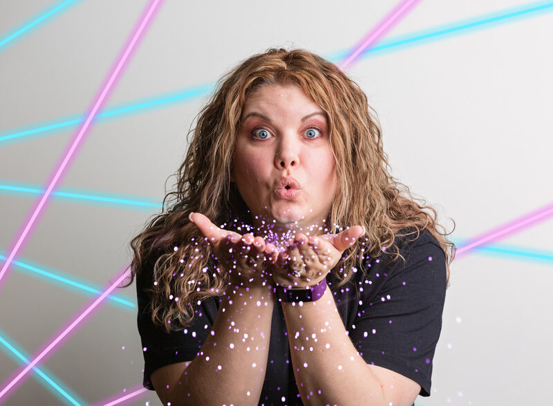 Photographer, Sandi Petersen, blows glitter and makes a silly face in this 1980's inspired photo.