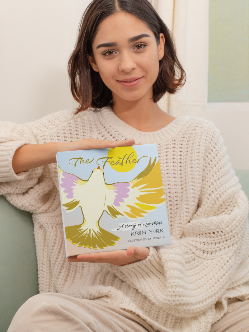 mockup-of-a-short-haired-woman-holding-a-square-book-with-both-hands-31047