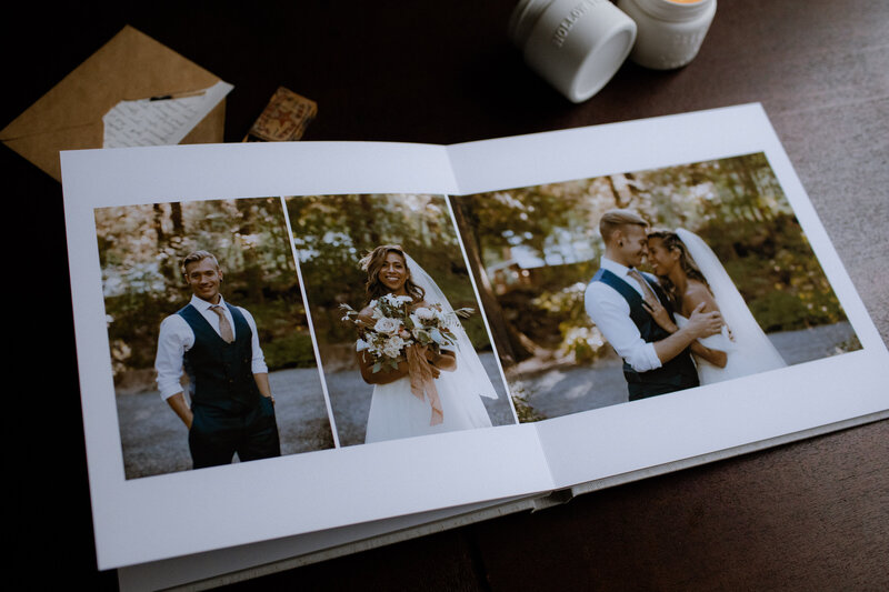 A photo of a wedding album spread with the bride and groom individual portraits in it