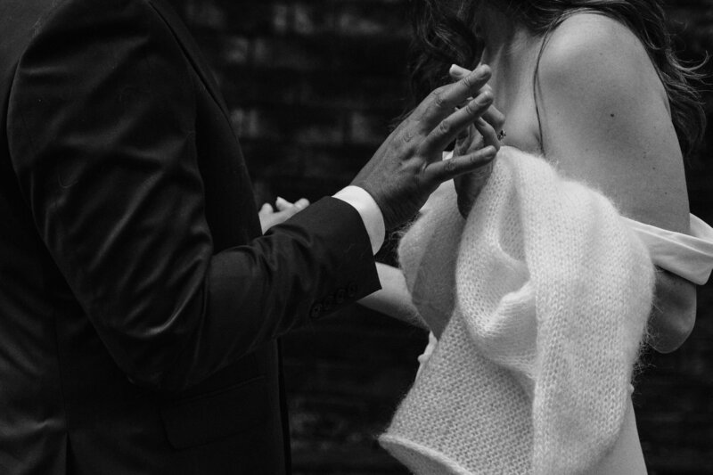 Couple holding hands on their wedding day